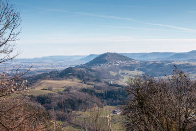 Scenic view of landscape and mountains against sky