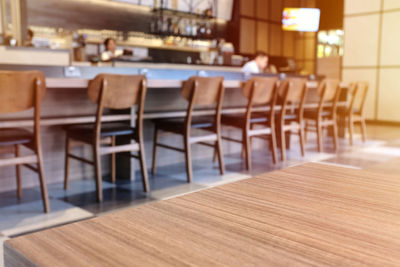 Empty chairs and table in restaurant