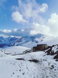 Scenic view of snow covered mountain against sky