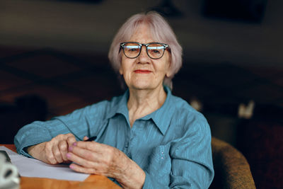 Portrait of senior woman wearing eyeglasses