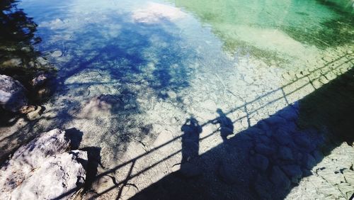 High angle view of people by swimming pool