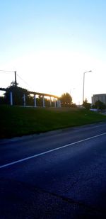 Empty road against clear sky