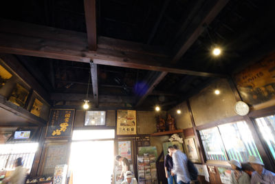 Low angle view of illuminated ceiling