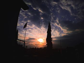 Low angle view of silhouette buildings against sky during sunset