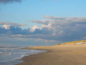 View of calm beach against the sky