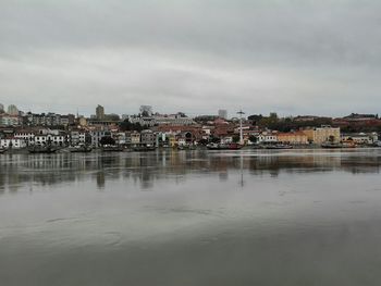 Houses in town against sky