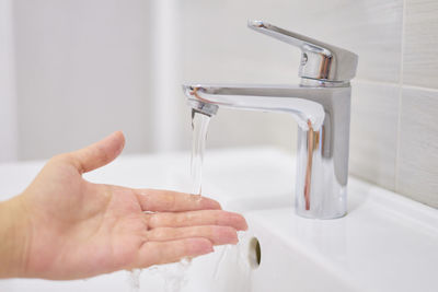 Midsection of man in bathroom