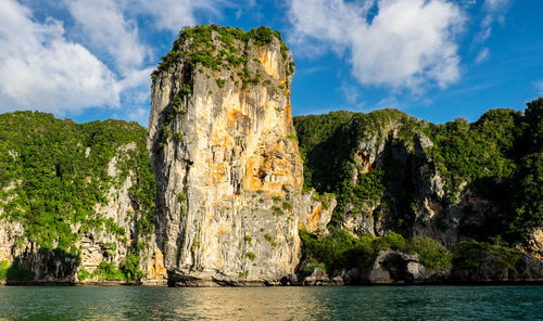 Panoramic view of rocks on sea against sky