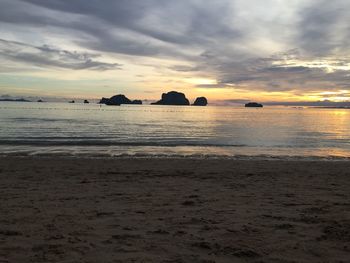 Scenic view of beach against sky during sunset