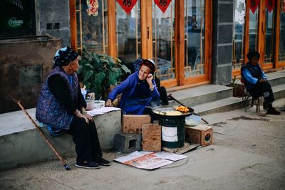 Men sitting outdoors