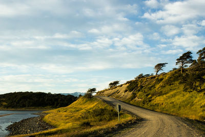 Empty road along countryside landscape