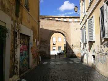 Footpath amidst buildings in town