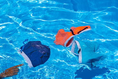 High angle view of swimwear in swimming pool 