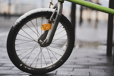 Close-up of bicycle parked on street