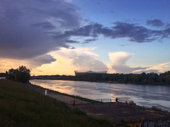 Scenic view of lake against sky during sunset
