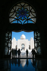 Group of people in front of historical building