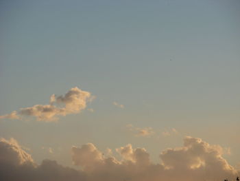 Low angle view of cloudy sky at sunset