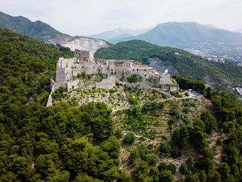 High angle view of trees and mountains against sky