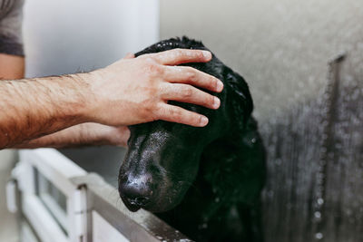 Close-up of man hand on black background