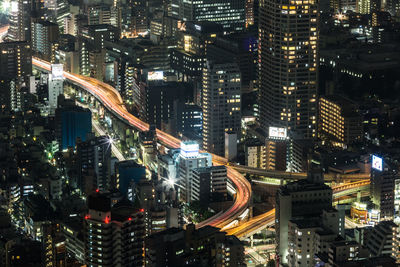 Aerial view of illuminated city at night