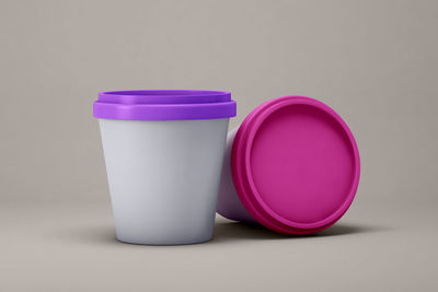 Close-up of cup of pink over white background