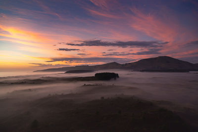 Scenic view of sea against sky during sunrise