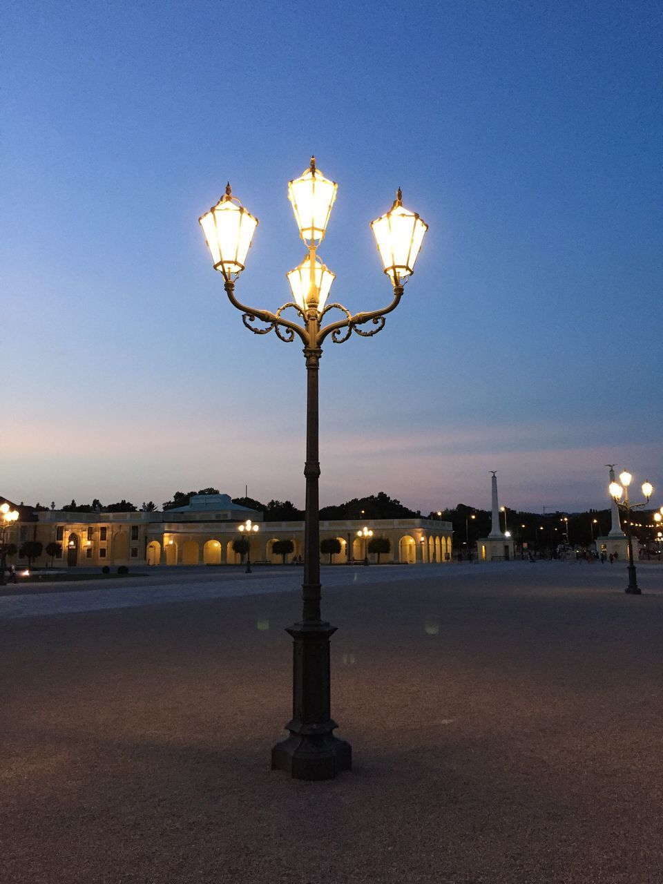 STREET LIGHT AGAINST BLUE SKY AT NIGHT