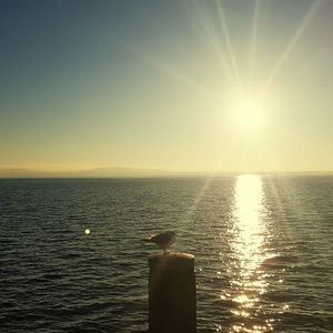 Scenic view of sea against sky at sunset