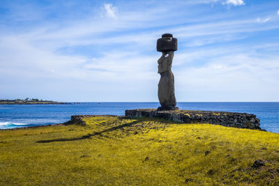 Scenic view of rocks on beach against sky