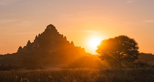 Cross against sky during sunset