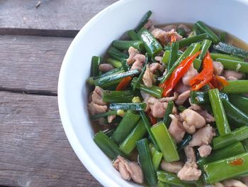 High angle view of chopped vegetables in bowl on table