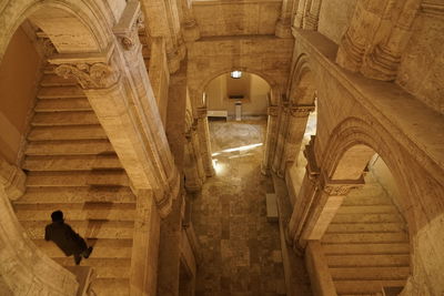 People on staircase in building