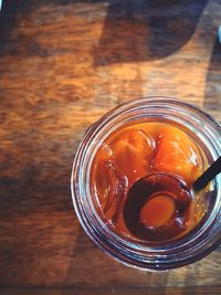 High angle view of glass of jar on table