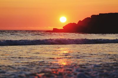 Scenic view of sea against sky during sunset