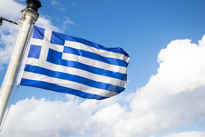 Low angle view of flag against sky