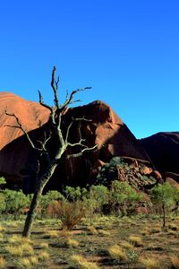 Scenic view of mountain against blue sky