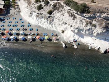 High angle view of people enjoying at beach during summer