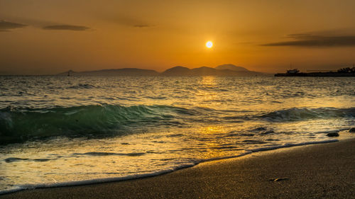 Dramatic sky over sea at sunset