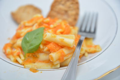 Close-up of pasta in plate on table