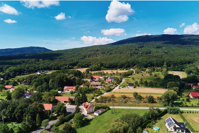 Village in mountains with forest, aerial view. mountain landscape