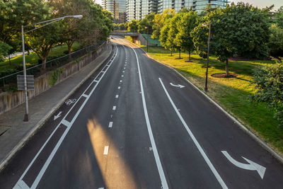 High angle view of road by trees in city