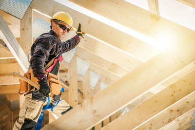 Side view of man working at home