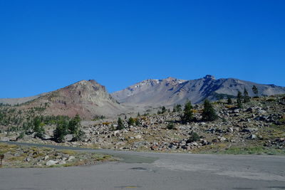 Scenic view of mountains against clear blue sky