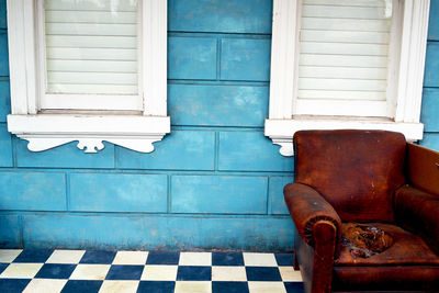 White window on blue wall