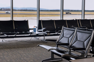 Empty chairs and tables at airport