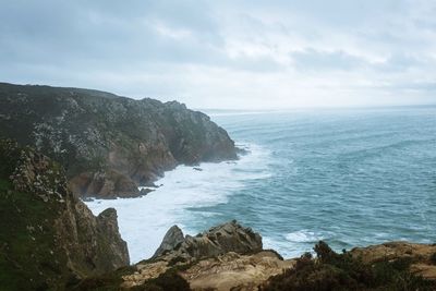 Scenic view of sea against cloudy sky