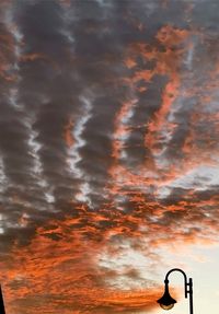 Low angle view of dramatic sky during sunset