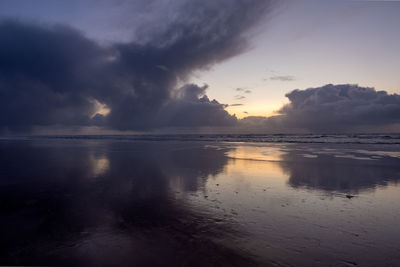 Scenic view of sea against sky during sunset