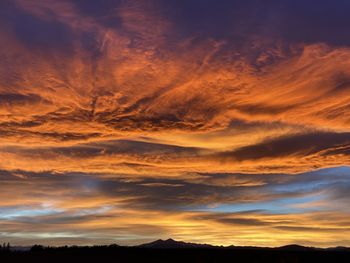 Low angle view of dramatic sky during sunset