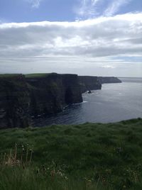 Scenic view of sea against cloudy sky